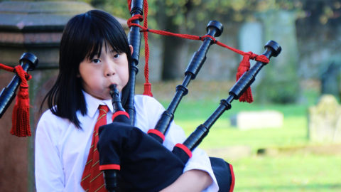 Two Wee Govan Pipers playing the bagpipes