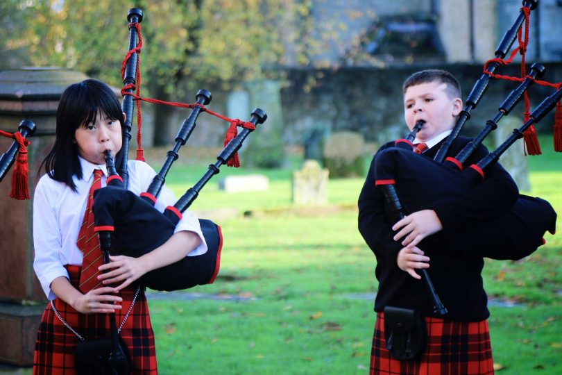 Two Wee Govan Pipers playing the bagpipes